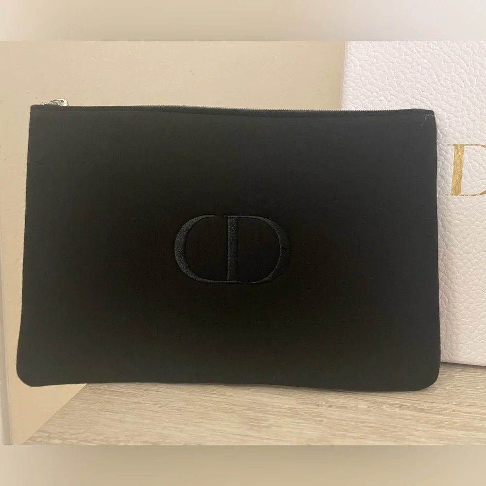 Authentic Dior flat pouch in Black. New. Comes with box.